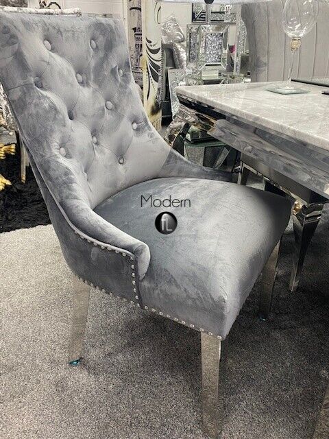 2 Grey velvet dining chairs with chrome legs & lion knocker