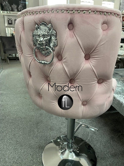 Pink velvet swivel bar stool with chrome Lion knocker and cross stitch