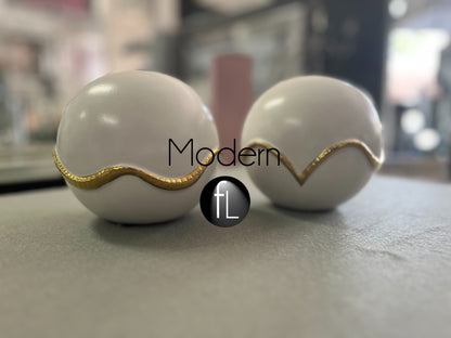 Pair of gold & white decorative balls