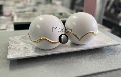 Pair of gold & white decorative balls