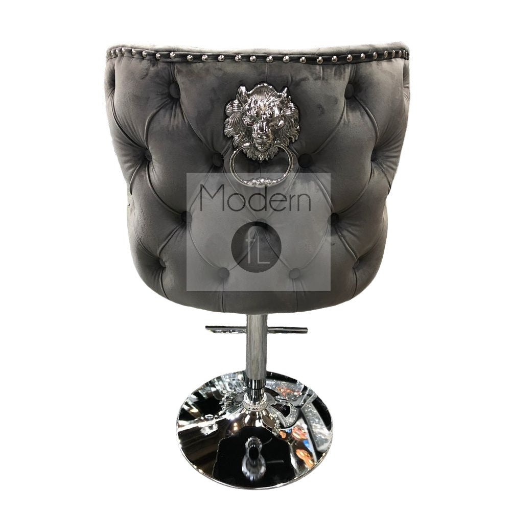 Grey velvet swivel bar stool with chrome Lion knocker and cross stitch